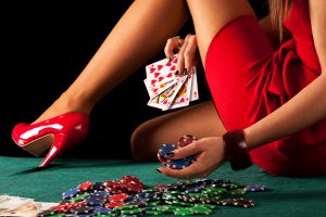 A sexy gambling woman with a poker royal flush